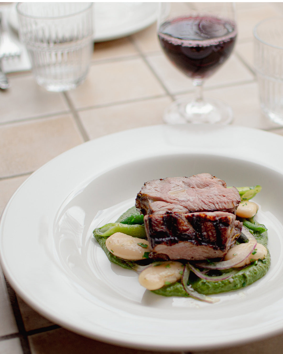 Bistro Allpress meal with a red wine