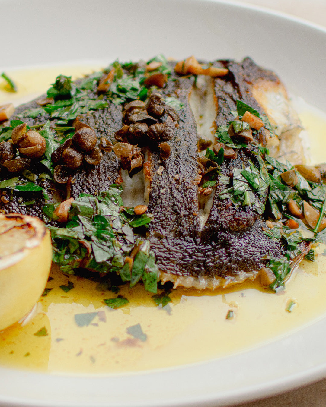 Flounder with fried capers dish at Bistro Allpress