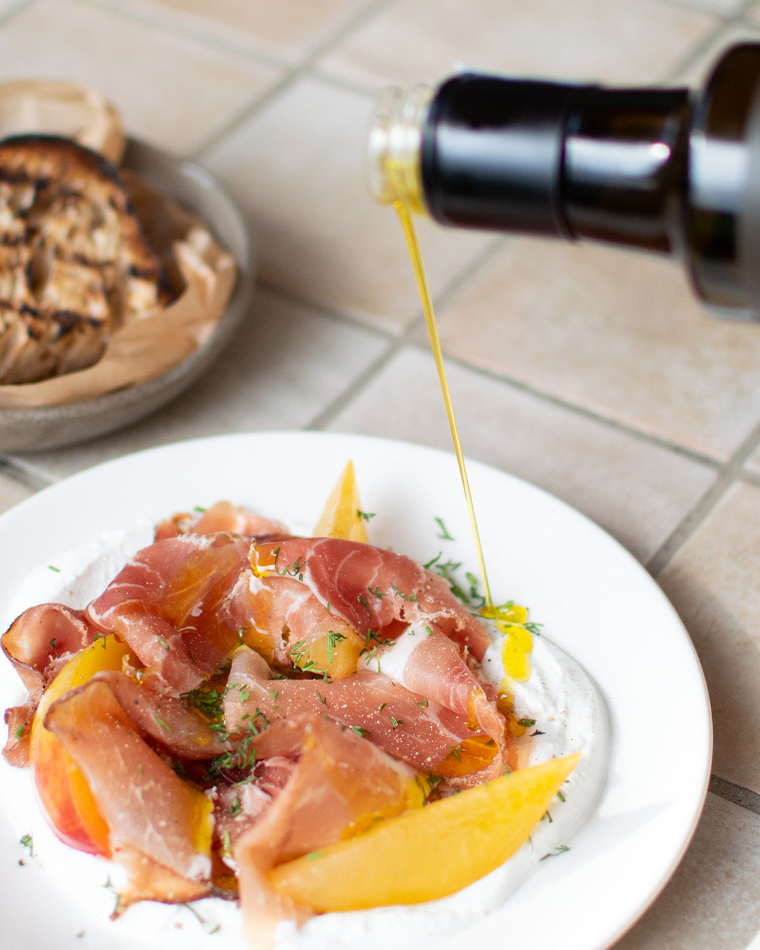 Summer dish from  Bistro Allpress pouring olive oil over it