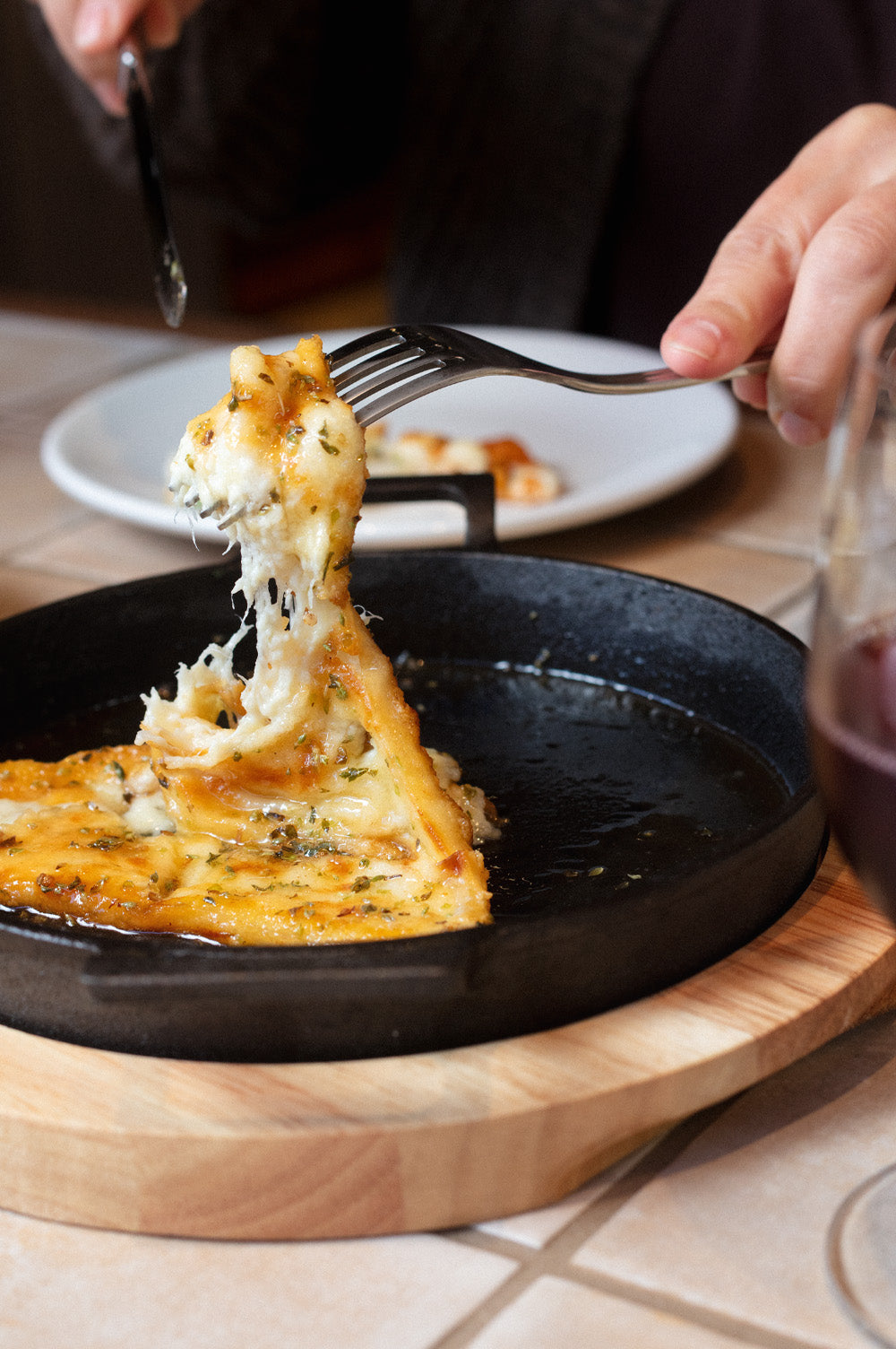 Saganaki cheese with honey and Greek oregano served at Bistro Allpress