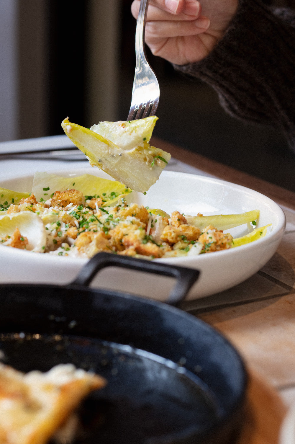 Seasonal witloof Caesar salad served fresh at Bistro Allpress