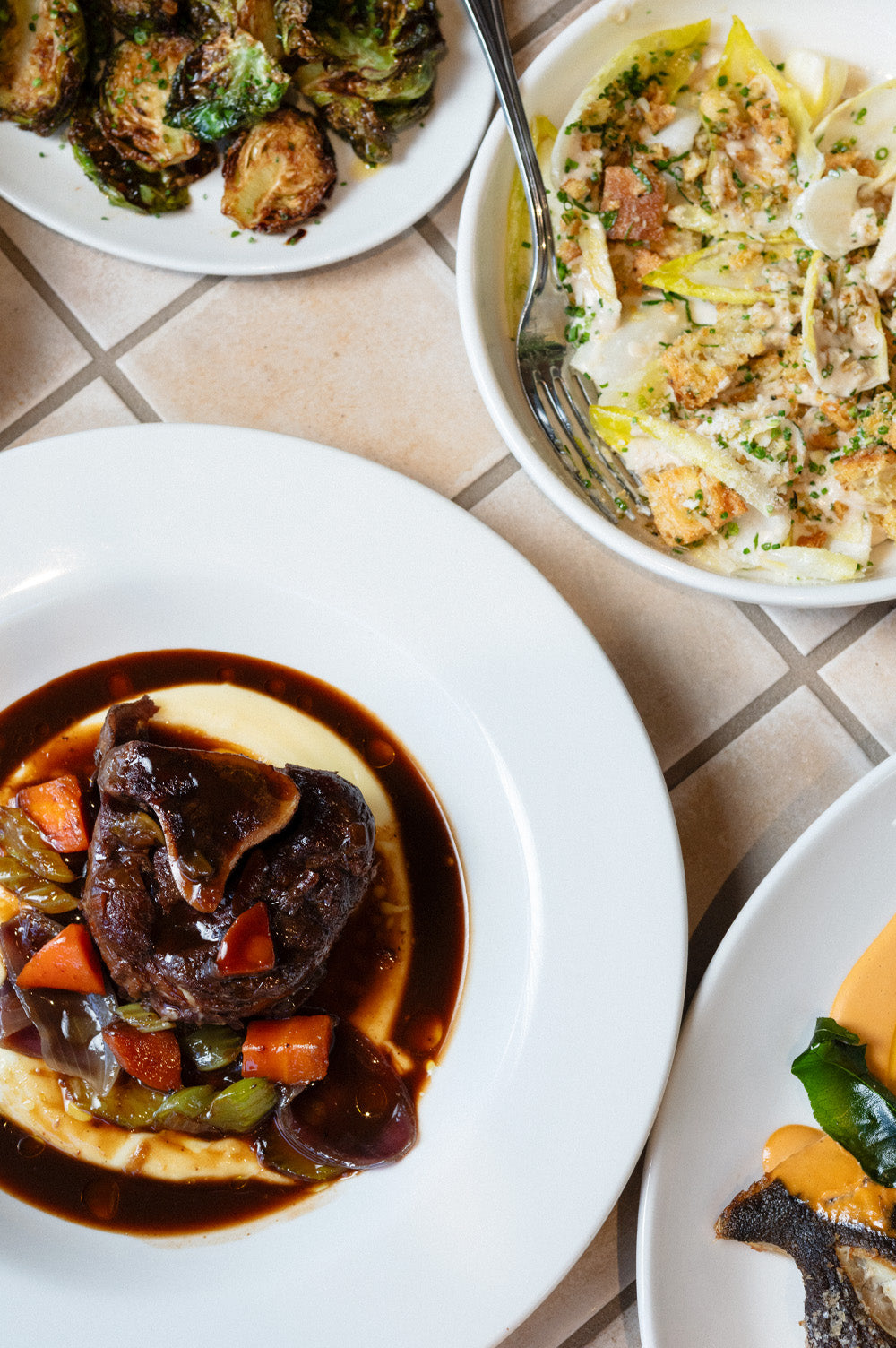 Seasonal dishes shared around the table at Bistro Allpress on Waiheke Island