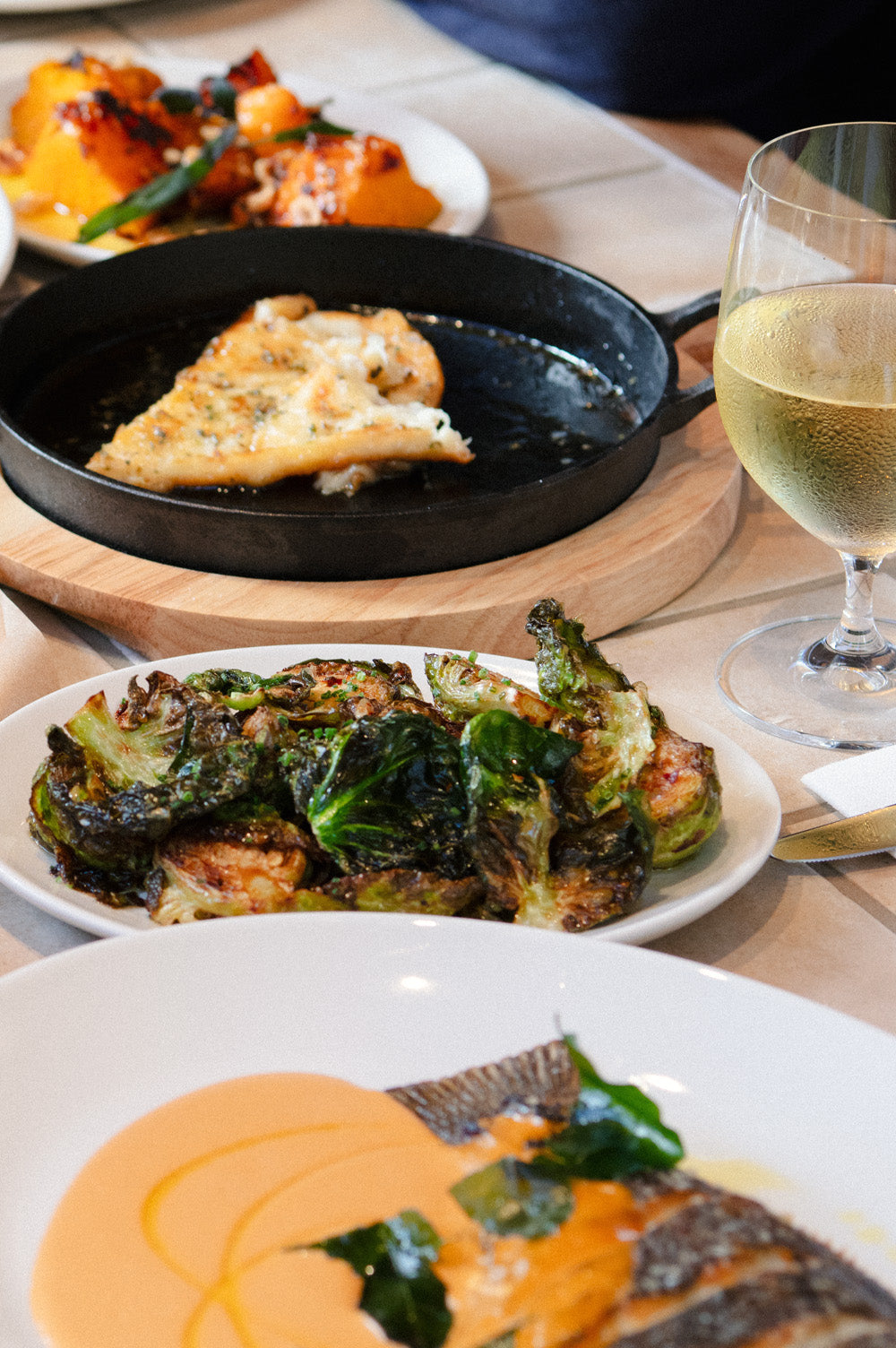 Seasonal dishes shared around the table at Bistro Allpress on Waiheke Island