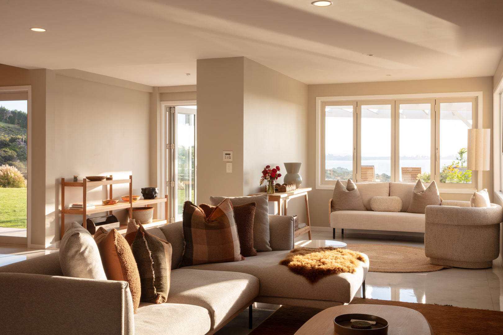 Modern living room with large windows overlooking the Hauraki Gulf